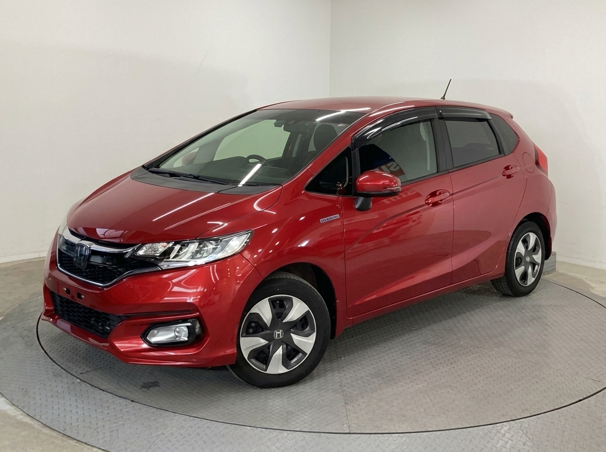 2019 Honda Fit Hybrid – 1.5L i-DCD Sport Hybrid | Low Mileage One Owner | No Repair History | Honda SENSING & Magic Seats | Vibrant Sunset Red Premium Hatchback